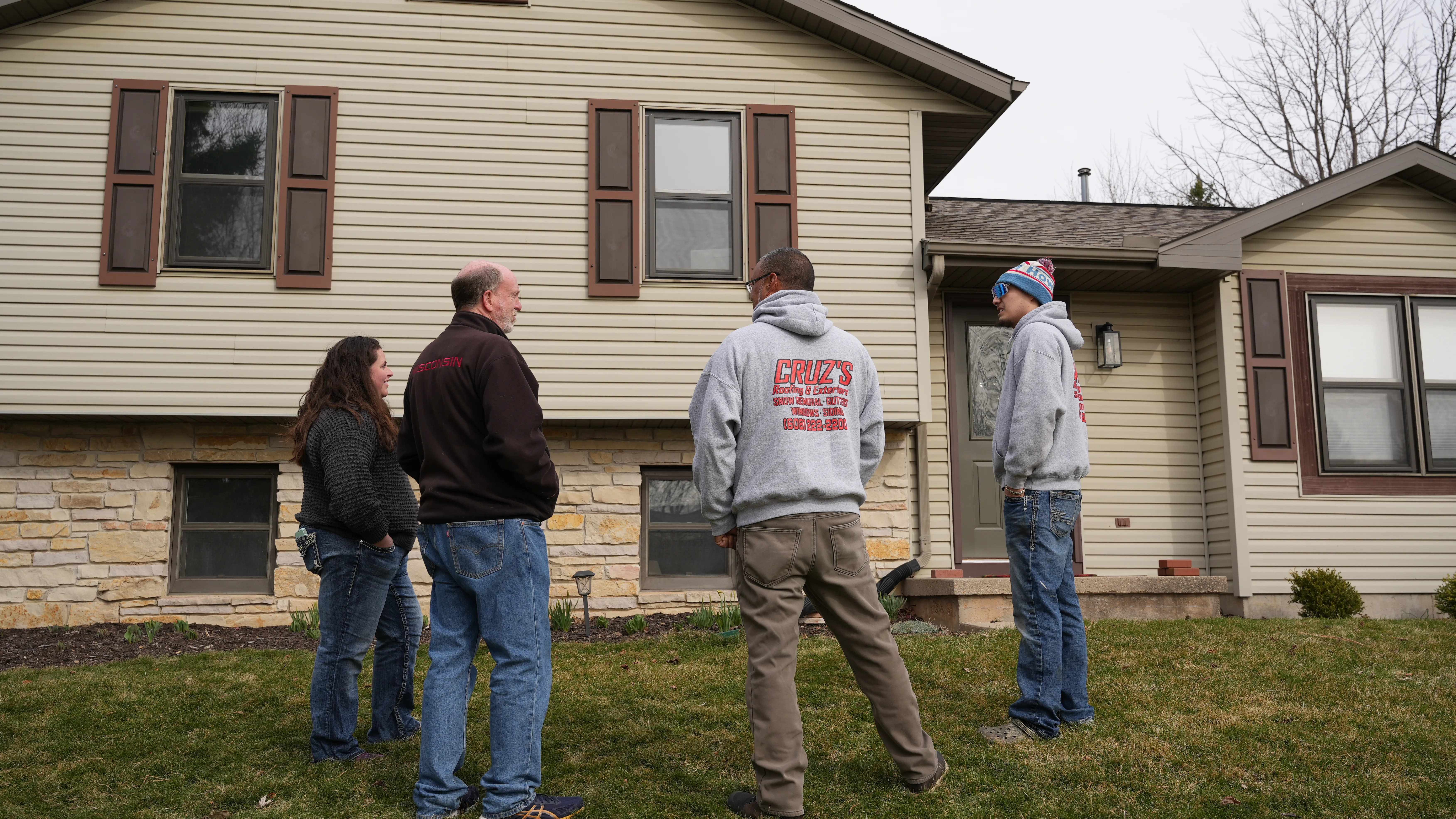 workers standing with client